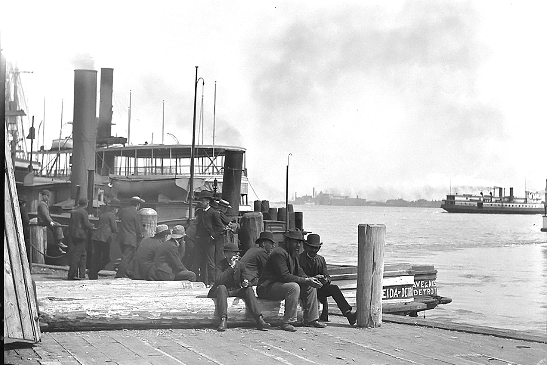 Group Of Men Sitting At End of Woodward Avenue (1920)