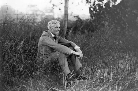 Henry Ford Sits In A Grass Field (1919)